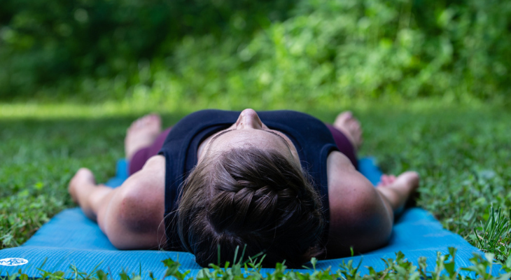 Yoga instructor demonstrates pose.