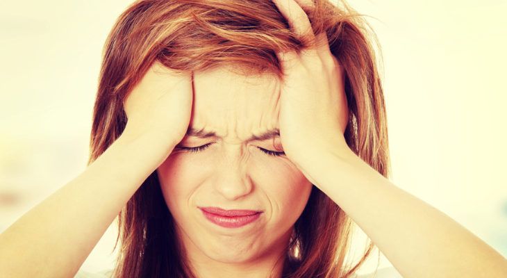 Woman has a headache.