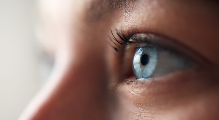 Close shot of woman's blue eyes.