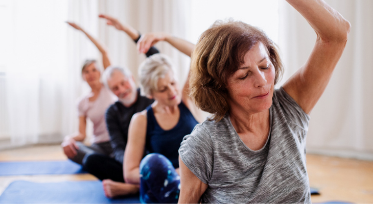 Old people doing yoga