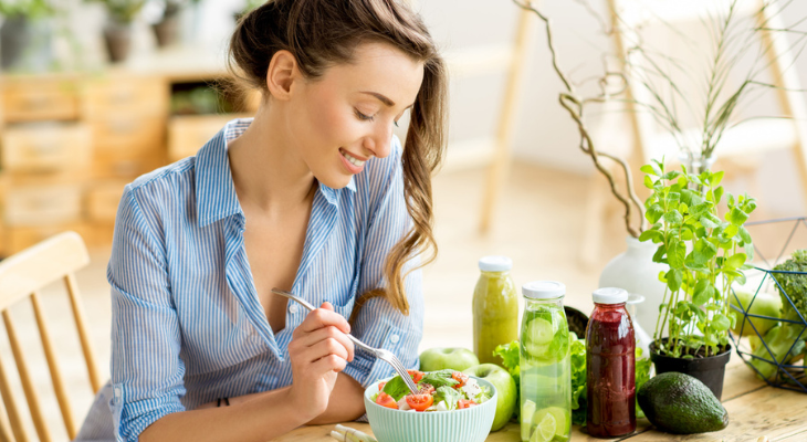 Woman enjoys healthy meal.