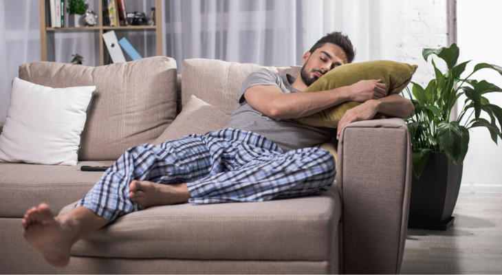 Man asleep on couch