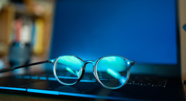 The glasses of a gamer with digital eye strain