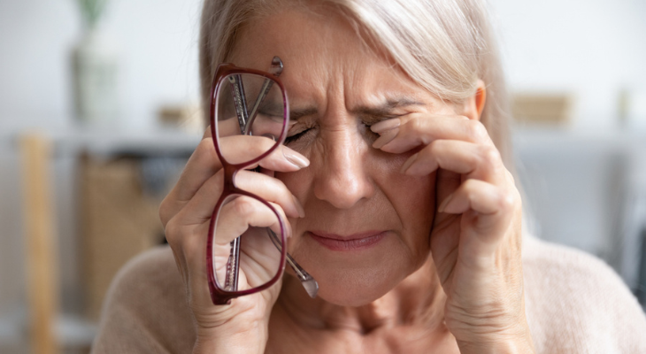 Old woman struggles with both vision and hearing loss.