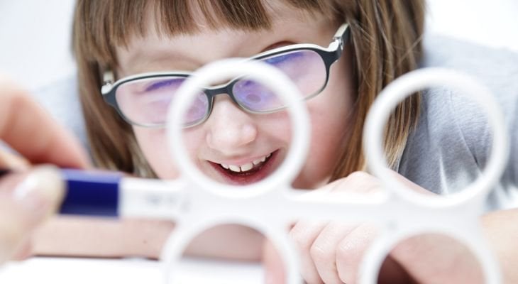 young girl doing vision therapy