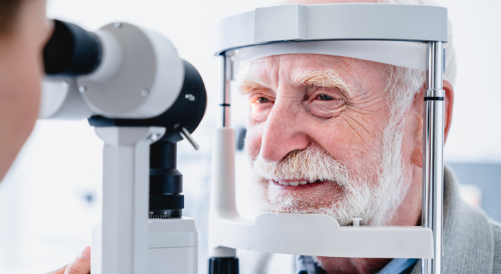 Old man getting eye exam