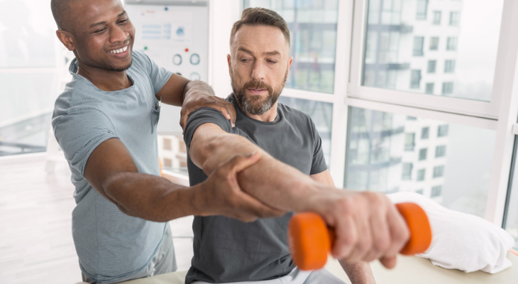 Patient getting help working out