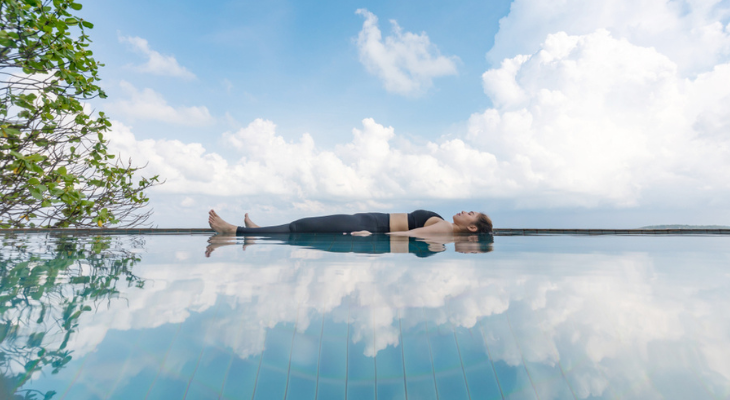 Woman practices yoga nidra.