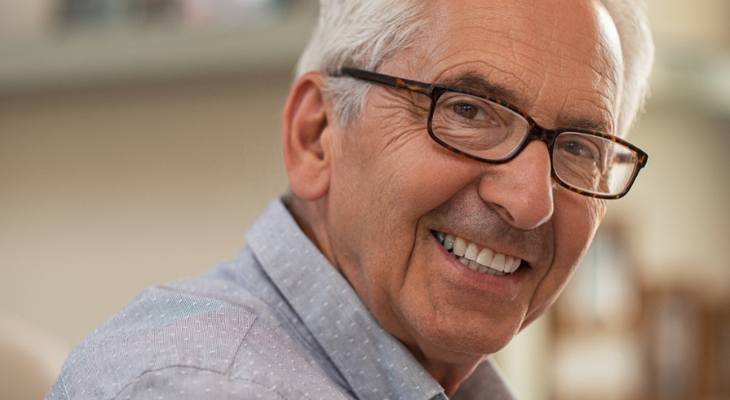 Old man still needs glasses after his cataract surgery.