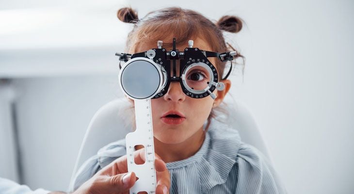 Young child having eyes examined