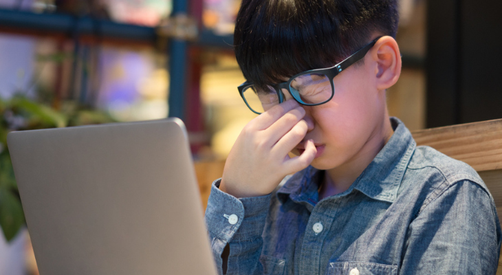 Little boy with digital eye strain