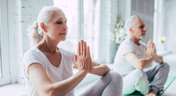 Old couple does yoga