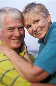 old couple smiling wearing dentures, dentist San Antonio, TX