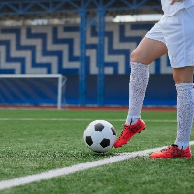 How Hard Should A Soccer Ball Be? Optimal Kick Dynamics