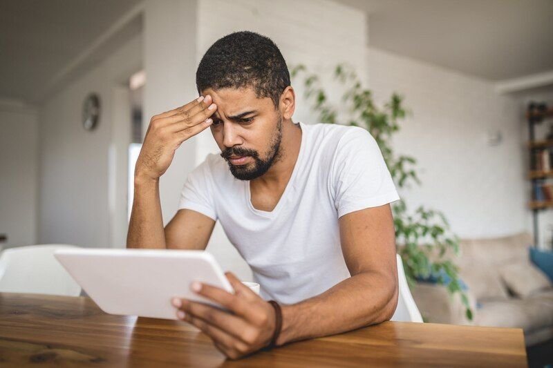 man reading tablet