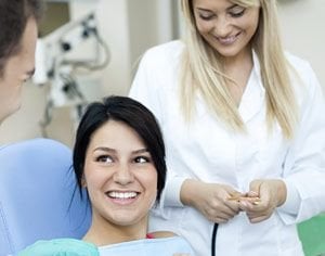 Photograph of smiling woman in dentist chair, cosmetic dentistry, El Paso, TX