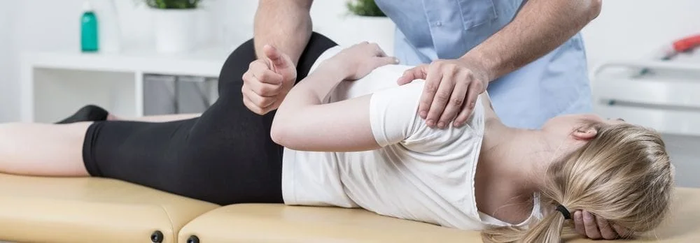 Woman getting chiropractic care in Lincoln.