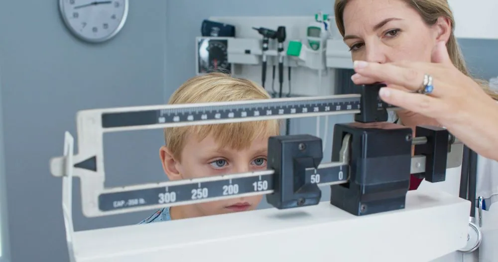 Child On Weighing Scale