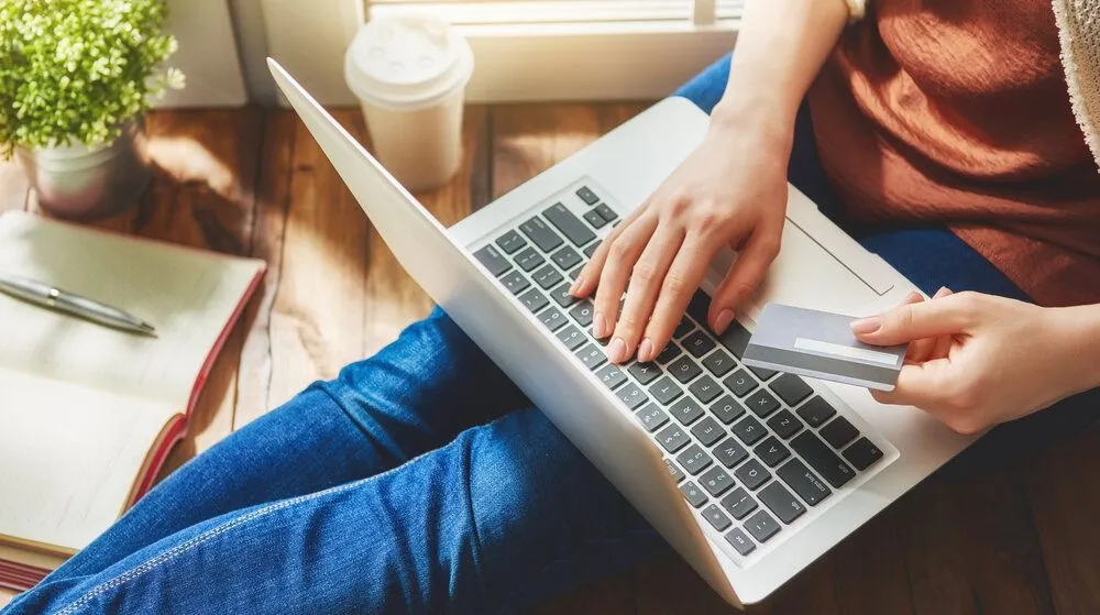 Woman using laptop for online payment