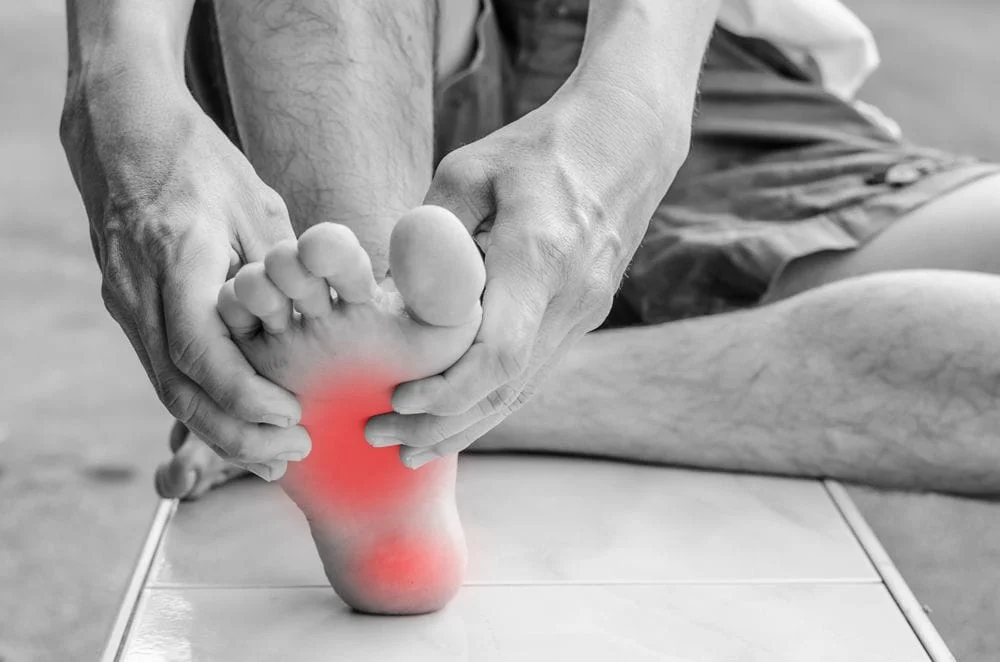 Chiropractor treating a patient for foot pain