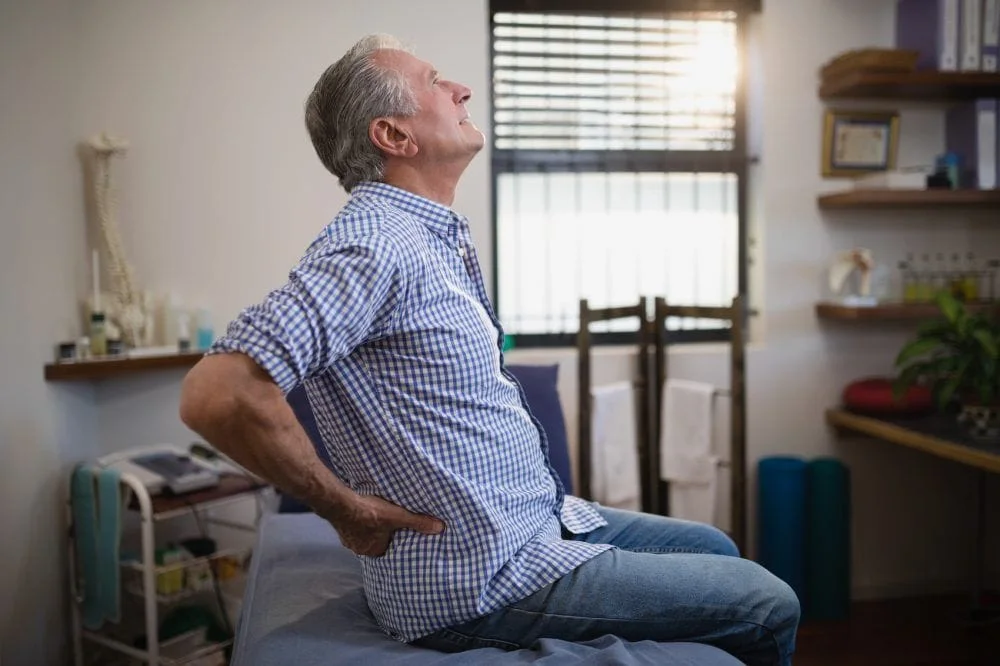 elderly man having back pain
