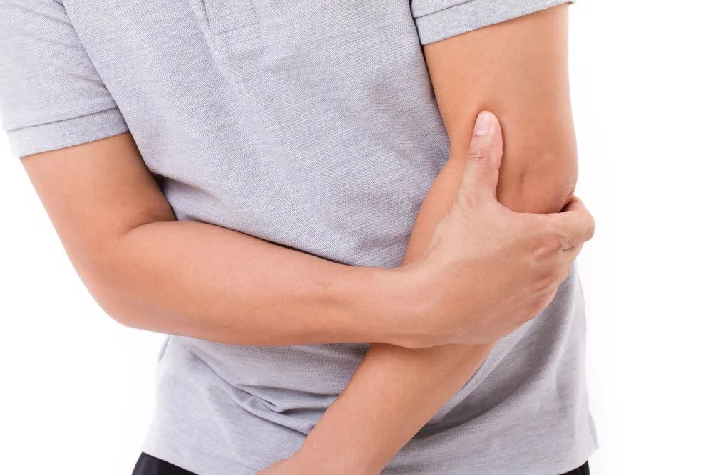 Man suffering from elbow pain