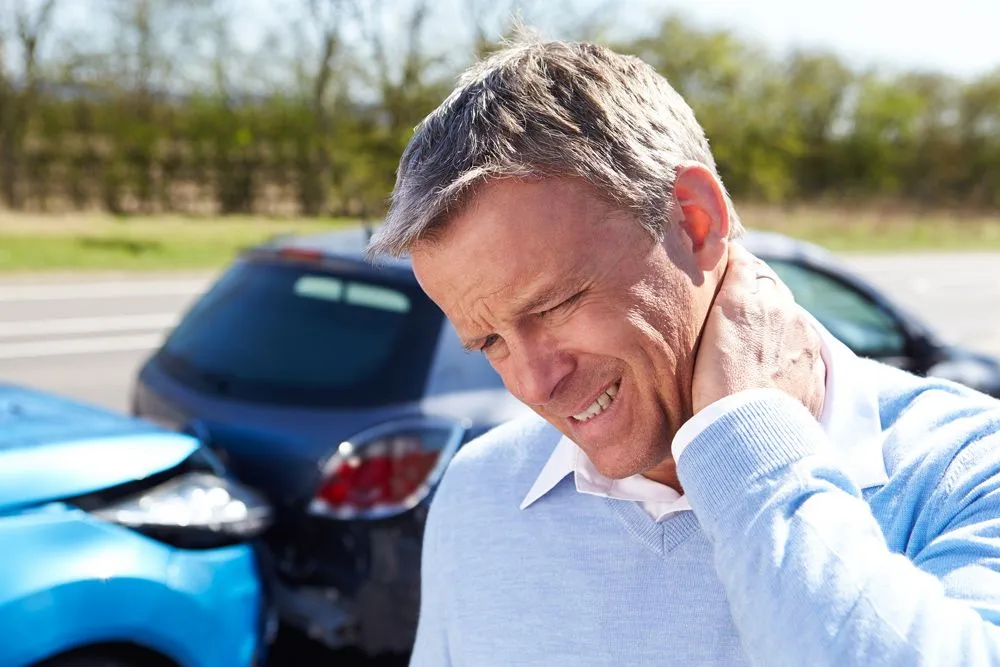 man suffering from whiplash