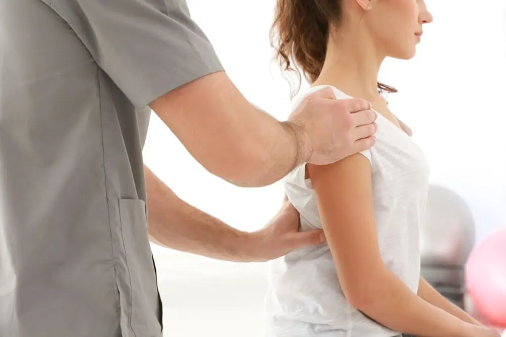 Chiropractor treating patient with sciatica