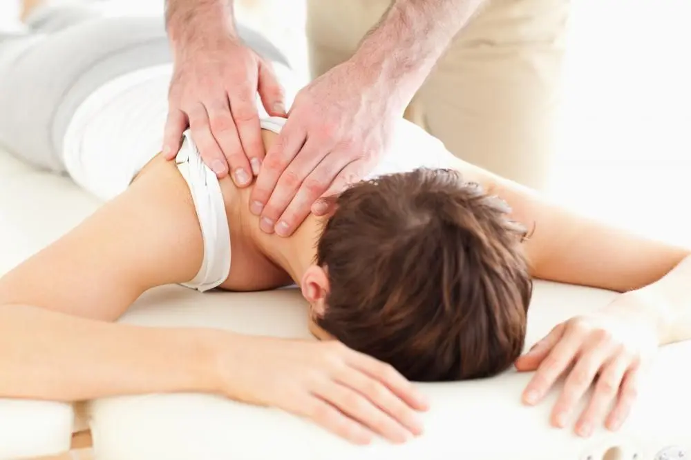 female patient laying down for neck treatment