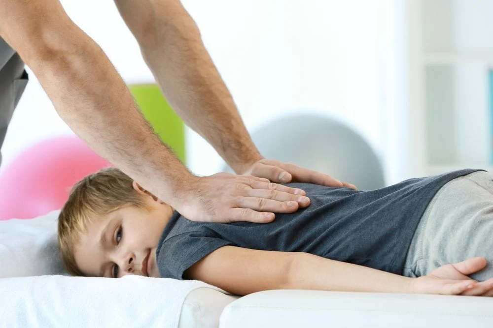 Child receiving pediatric chiropractic care