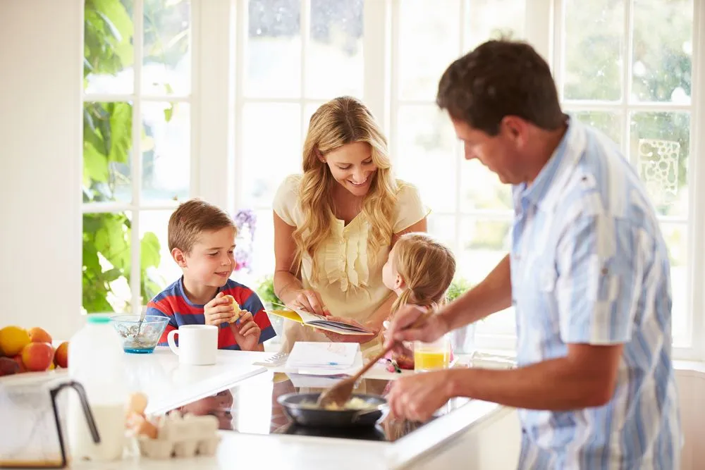 Family cooking together healthy food.