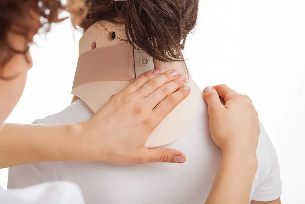 woman wearing neck brace