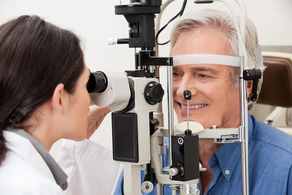 Man getting checked for eye diseases in Hamilton, ON.