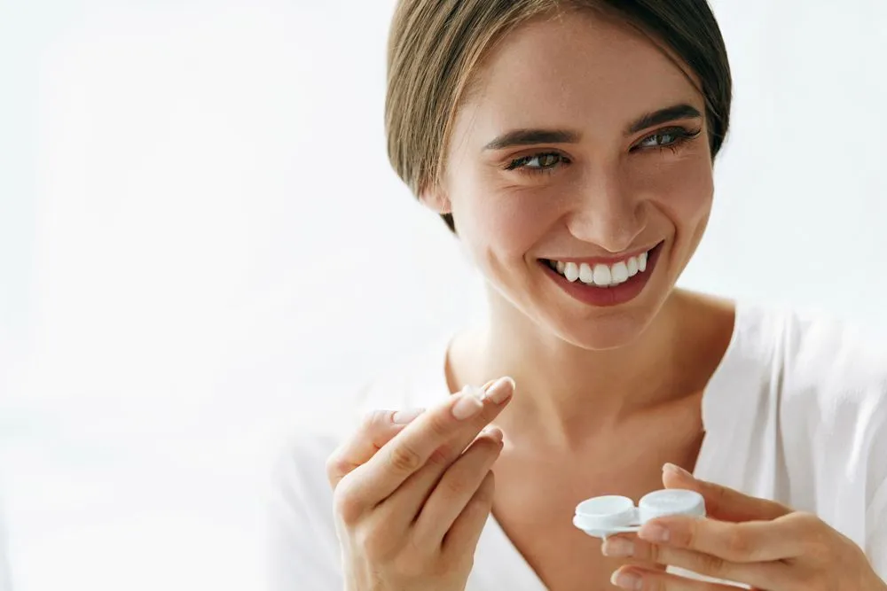 Woman putting in her hard-to-fit contact lenses