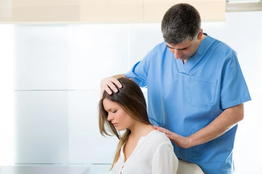 woman getting a chiropractic adjustment