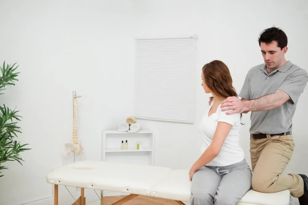 Woman seeing Cirmingham Chiropractor for Pain management