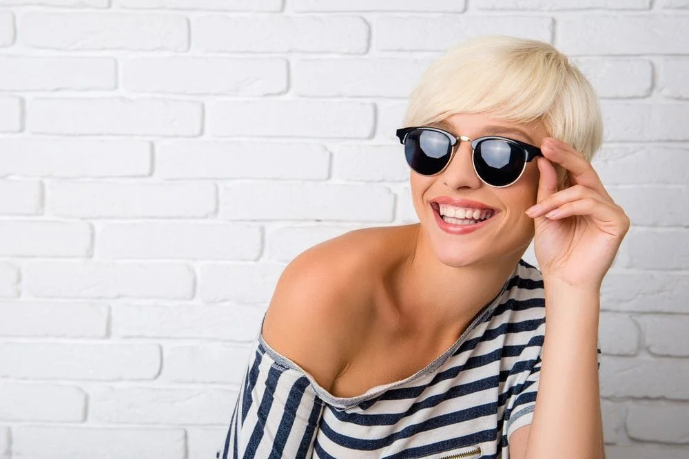 woman wearing sunglasses and smiling