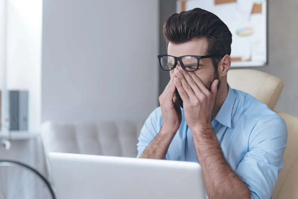 Man suffering from strained eyes