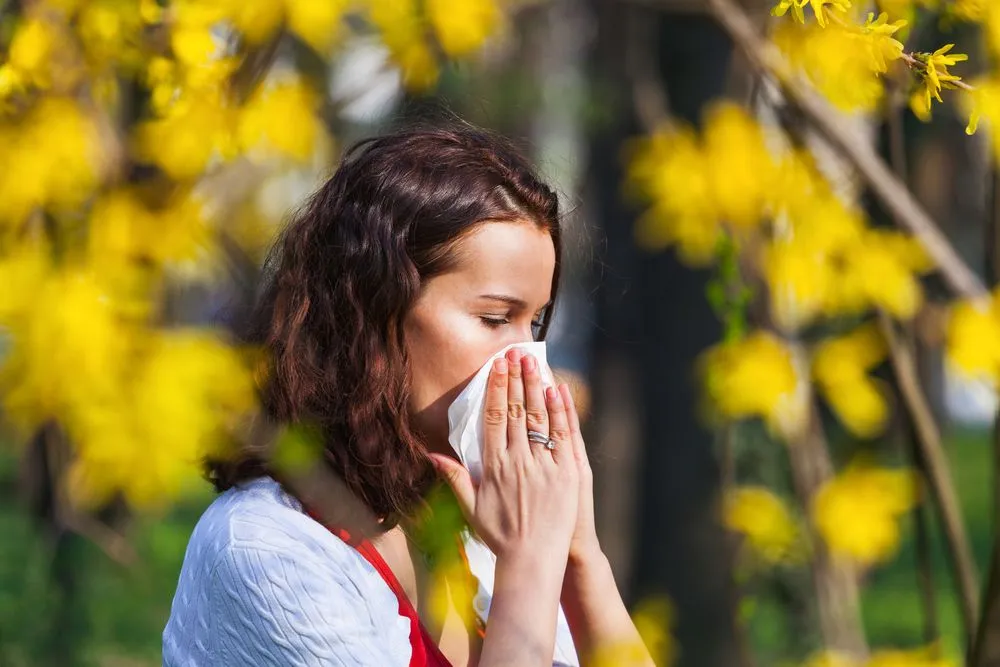 Woman struggling with eye allergies.