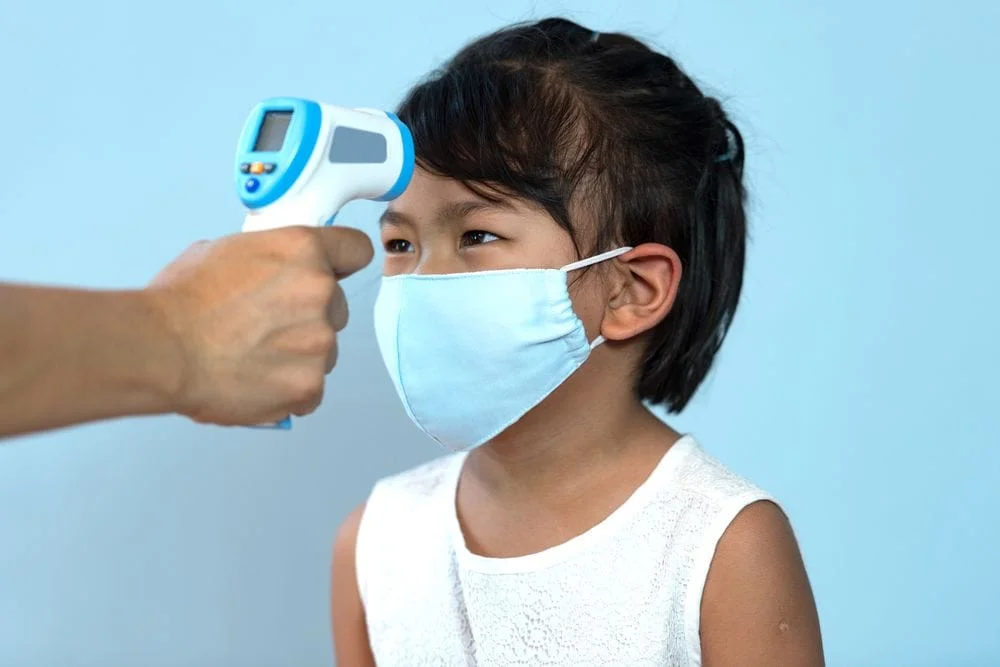 Sick Child Visits Temperature being taken of child