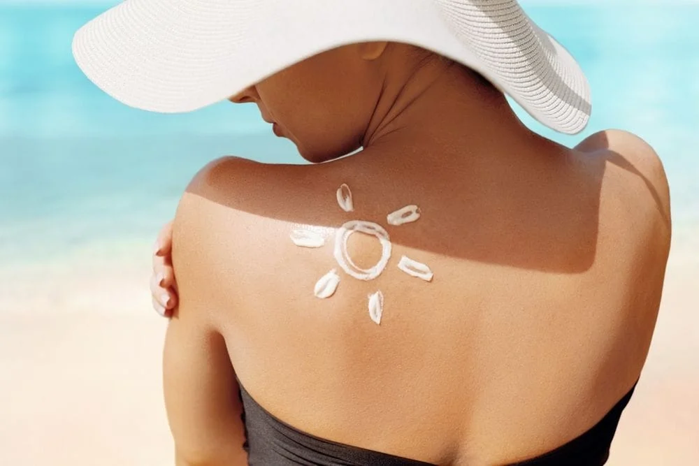 Woman Applying Sunscreen