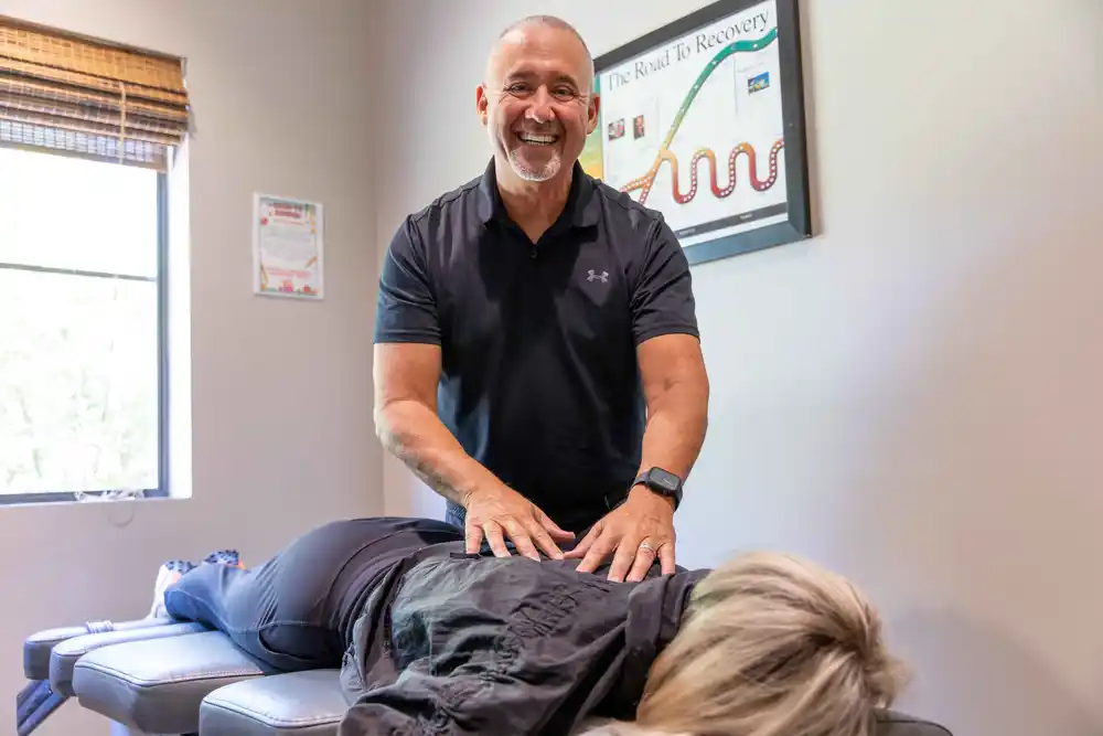 Doctor adjusting patient