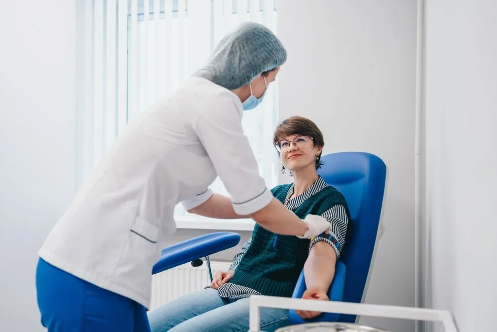 Adult receiving blood draw
