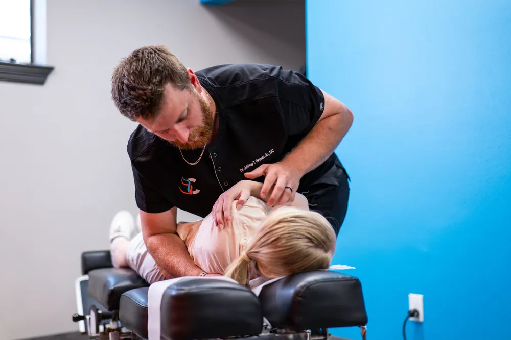 Doctor adjusting patient