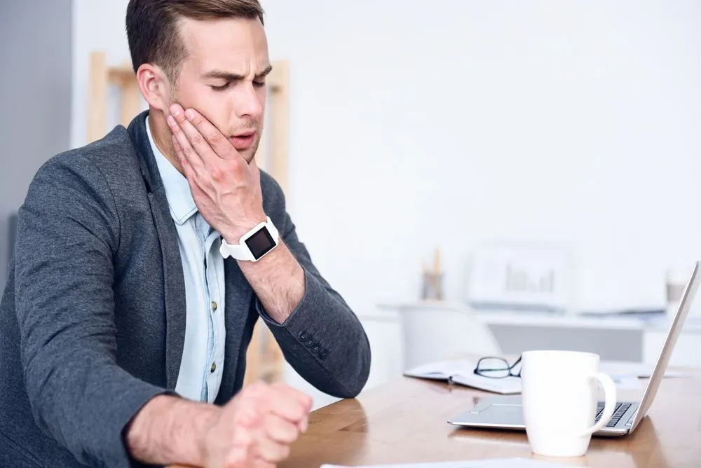 man with TMJ pain in jaw