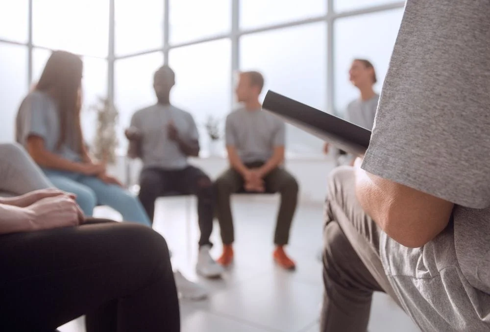 Group of people seated in a circle