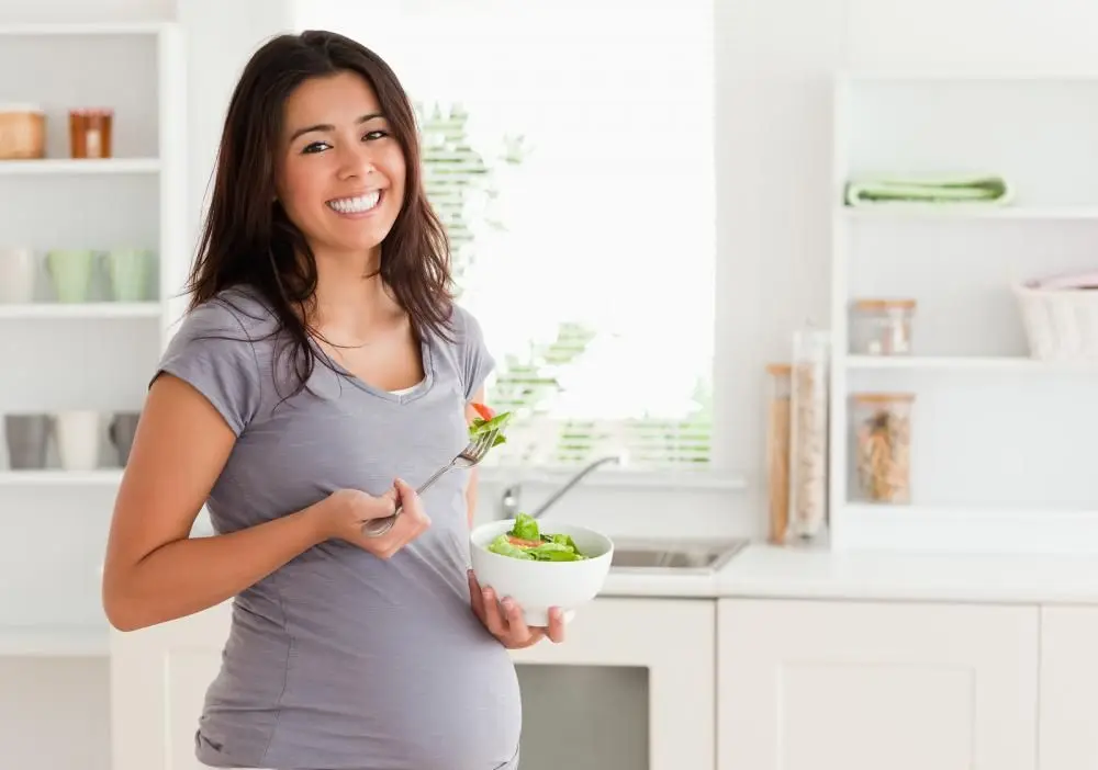 pregnant woman eating a health meal