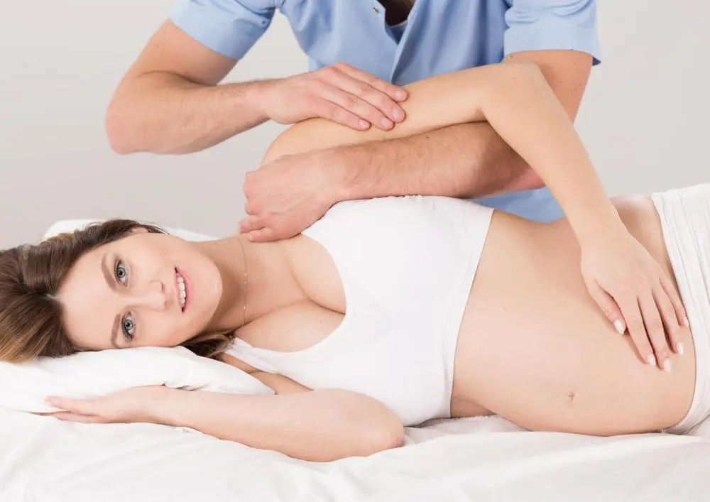 Pregant woman receiving chiropractic care