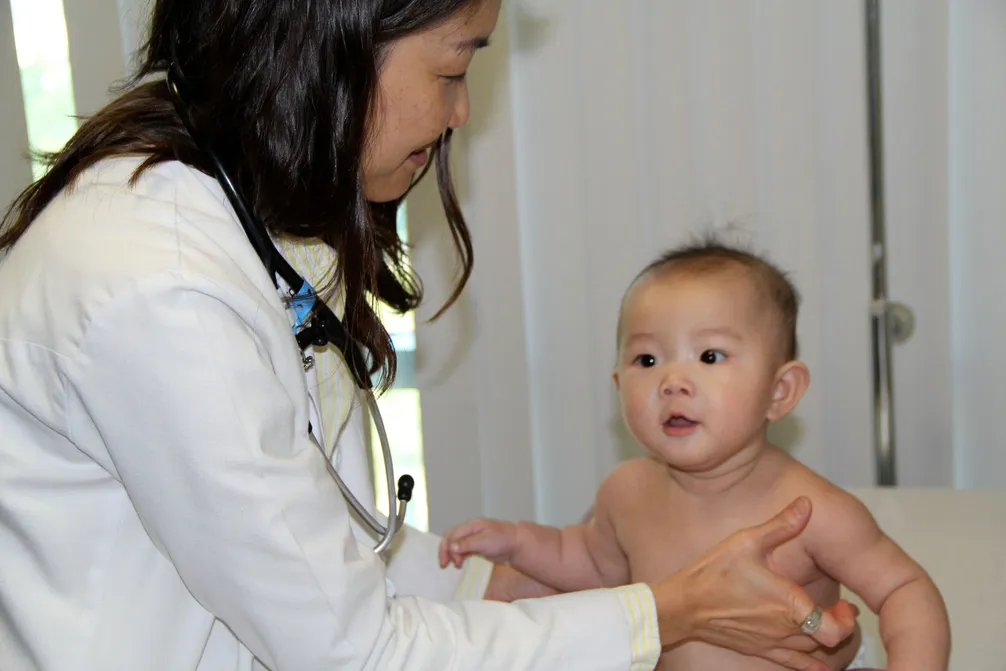 Dr. Han with a young patient