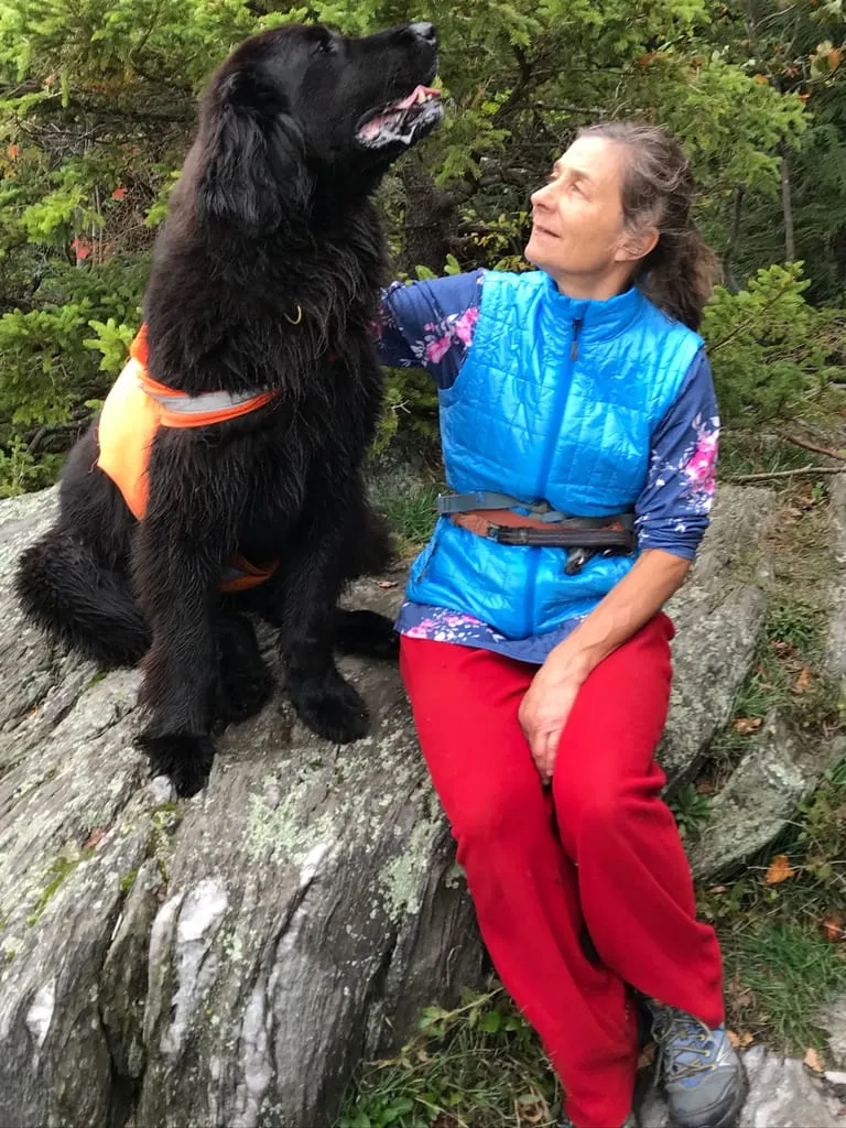 Julie and her newfie on a walk.